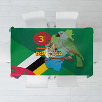 Green tablecloth with Dominica flag and map design, decorative bird graphic