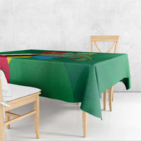 Green Independence Day tablecloth draped over wooden dining table