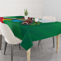Green tablecloth with flag and map print over square dining table