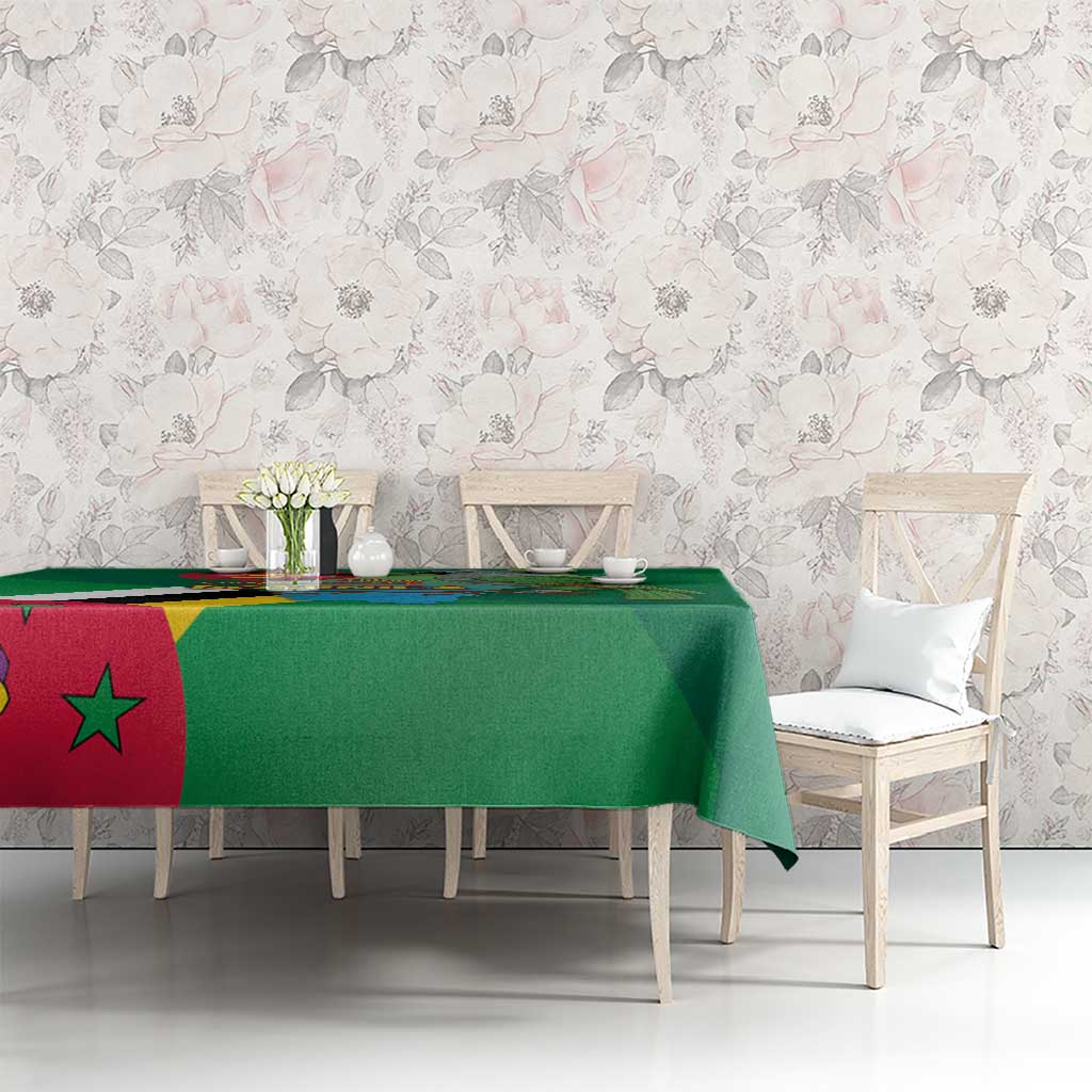 Green tablecloth with Dominica flag and map print across table