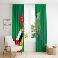 Green curtains with Dominica flag and parrot artwork, hung over a window