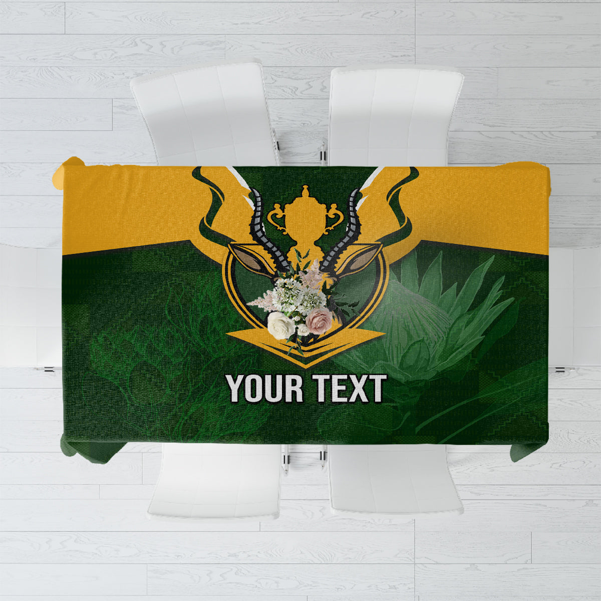 Green rugby-themed tablecloth with Springbok crest and yellow border, plus editable text area.