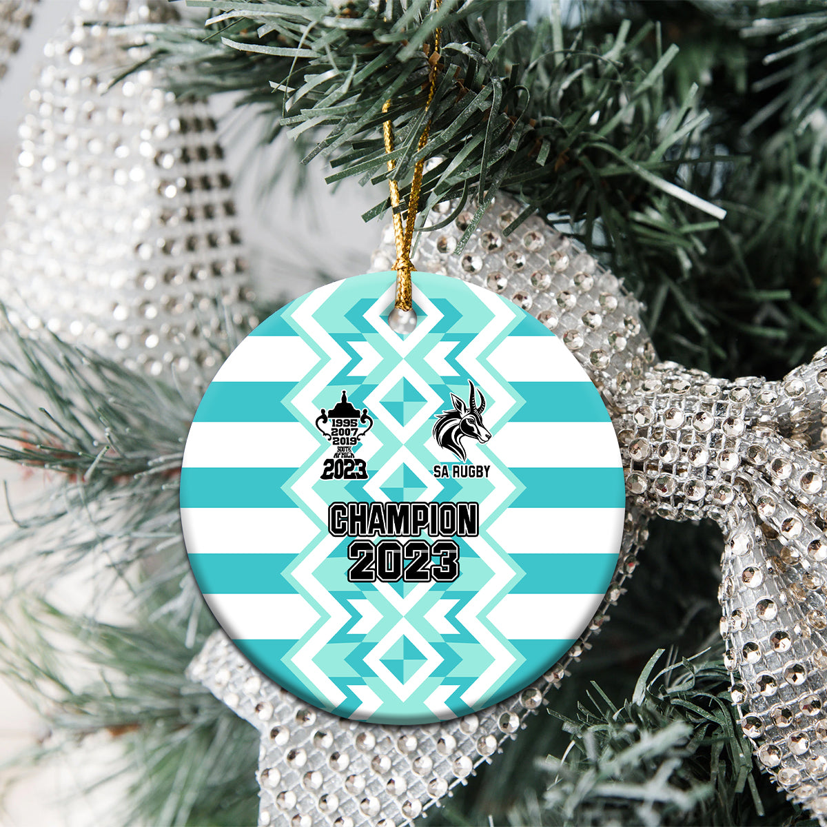 Blue ceramic rugby ornament round disc with gold string, champion 2023 text and SA Rugby logo.