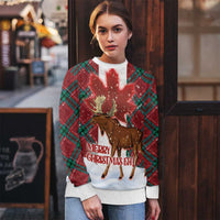 Ugly Christmas sweater on model: moose graphic with green plaid sleeves and red base