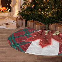 Red plaid round tree skirt with moose and maple graphic, fringed border