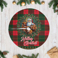 Red and green tartan Christmas tree skirt with Santa, cows graphic and white fringe