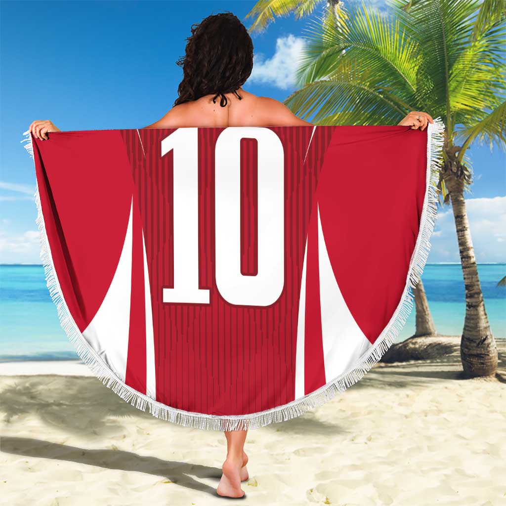 Red round beach blanket, jersey graphic showing large number 10, fringed edge