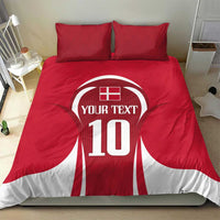 Red football bedding set with jersey-style '10' graphic comforter and two matching pillows