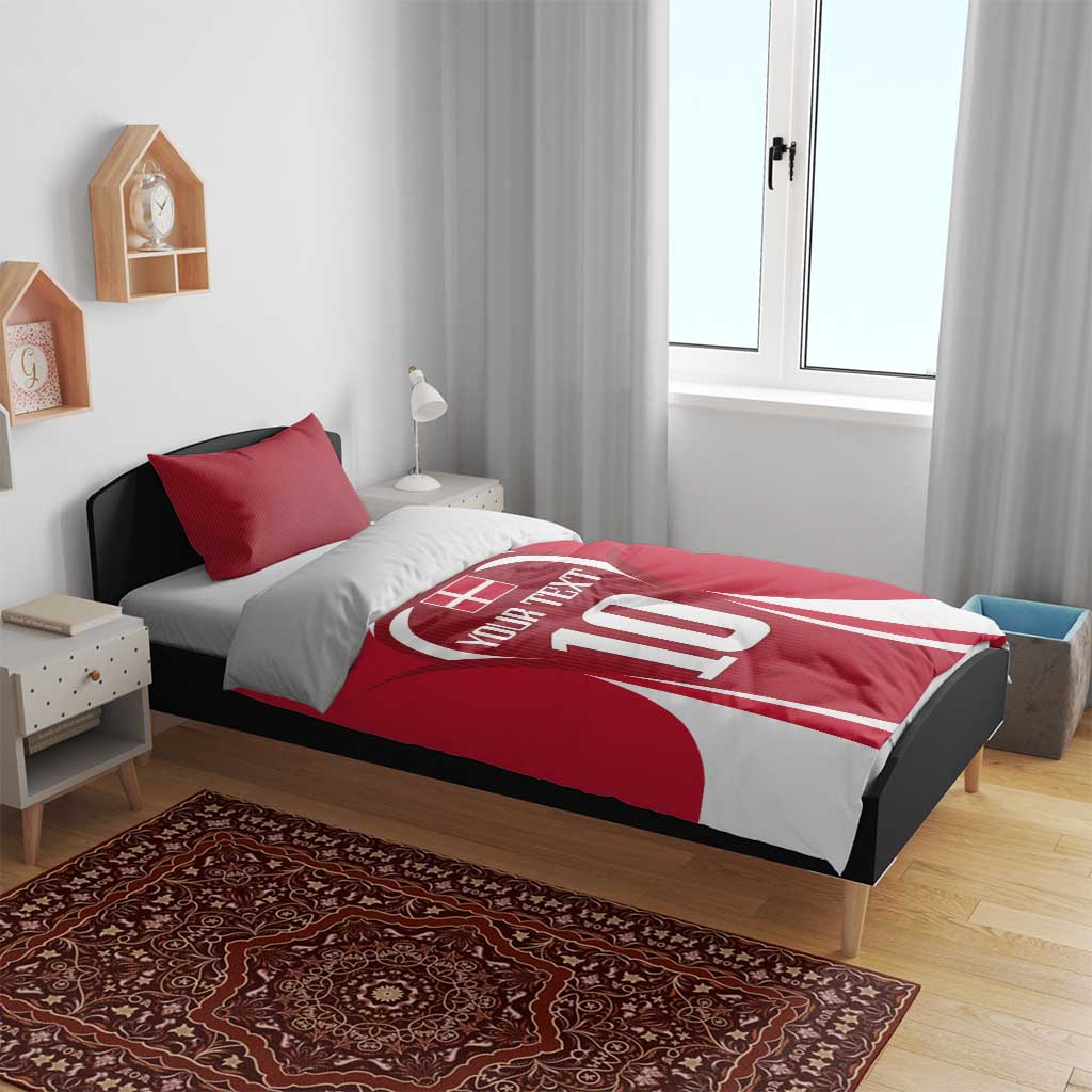 Red football bedding set with jersey-style '10' comforter and two striped pillowcases