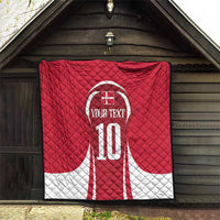 Red and white quilt blanket with number 10 and custom text emblem on front