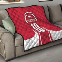 Red and white quilt blanket on sofa with number 10 and custom text graphic