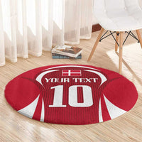 Red round football carpet with Your Text and 10 graphic on hardwood floor