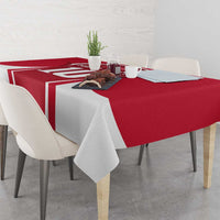 Red and white striped tablecloth with football jersey logo on a dining table