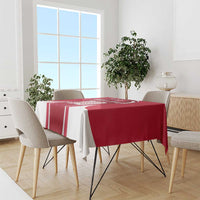 Red and white tablecloth with vertical stripes on dining table