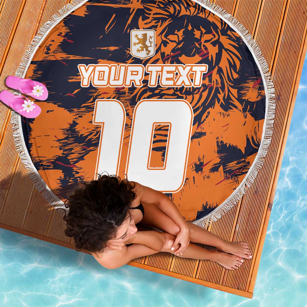 Orange round beach blanket with navy tiger-style print, YOUR TEXT 10, white fringe edge