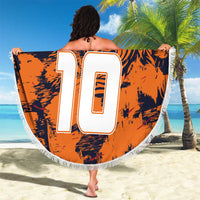 Orange round beach blanket with navy tiger print, large white 10, crest, white fringe