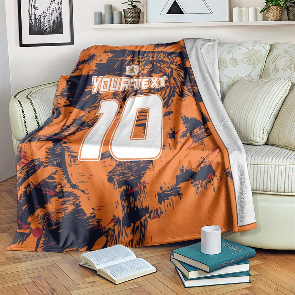 Orange and navy throw blanket with lion graphic, large white 10, and your text