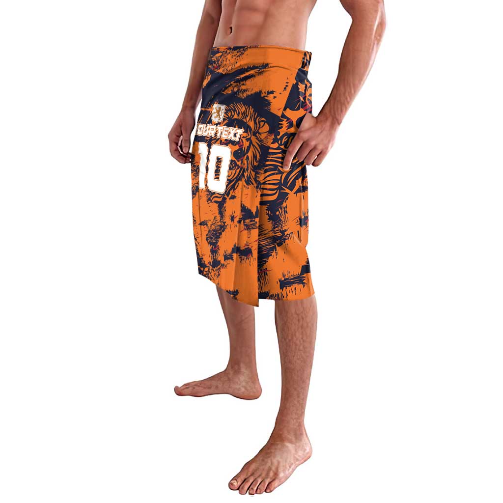 Orange patterned football-style shorts with black graphics and number 10