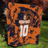 Orange quilt blanket with navy tiger graphic and large white number 10 centerpiece