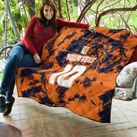 Orange quilt blanket with navy tiger print and large white number 22 design