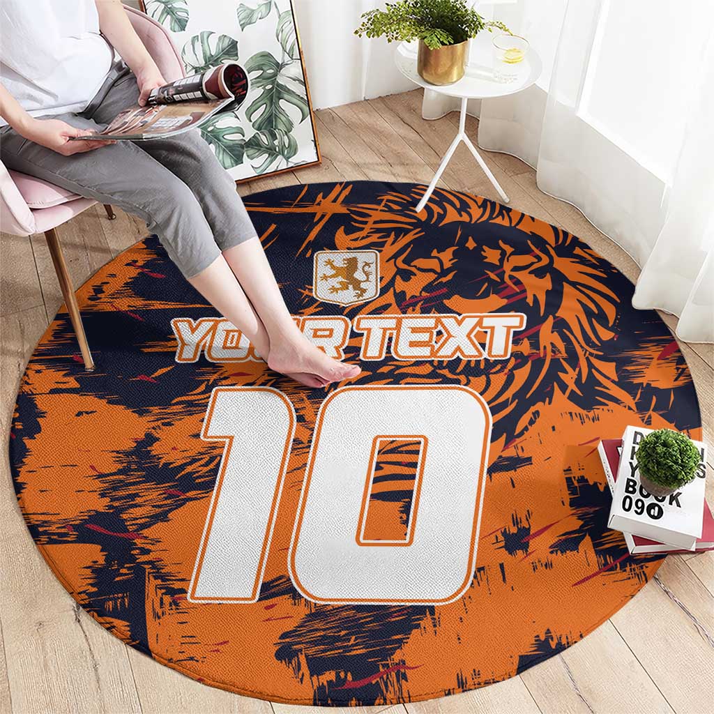 Orange round carpet with navy graphic and large '10' outline for custom text