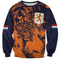 Unisex crewneck sweatshirt in orange and dark navy with lion pattern and crest patch