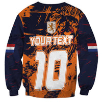 Unisex crewneck sweatshirt in orange and dark navy with large 10 graphic and crest