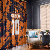 Orange and navy sports-themed window curtains with large jersey numbers and lion graphic, draped.