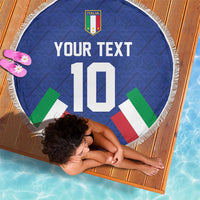 Blue round beach blanket with fringe, Italia crest and number 10 design on the ground