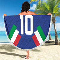 Blue round beach blanket with fringe, Italia crest and number 10 graphic held up outside