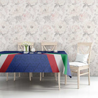 Blue tablecloth with Italian flag stripes across the center on a dining table