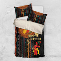 Black bedding set laid flat with Happy Kwanzaa print, tribal stripes, and two matching pillowcases