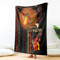 Black blanket featuring “Happy Kwanzaa” lettering, circular portrait, and striped accents