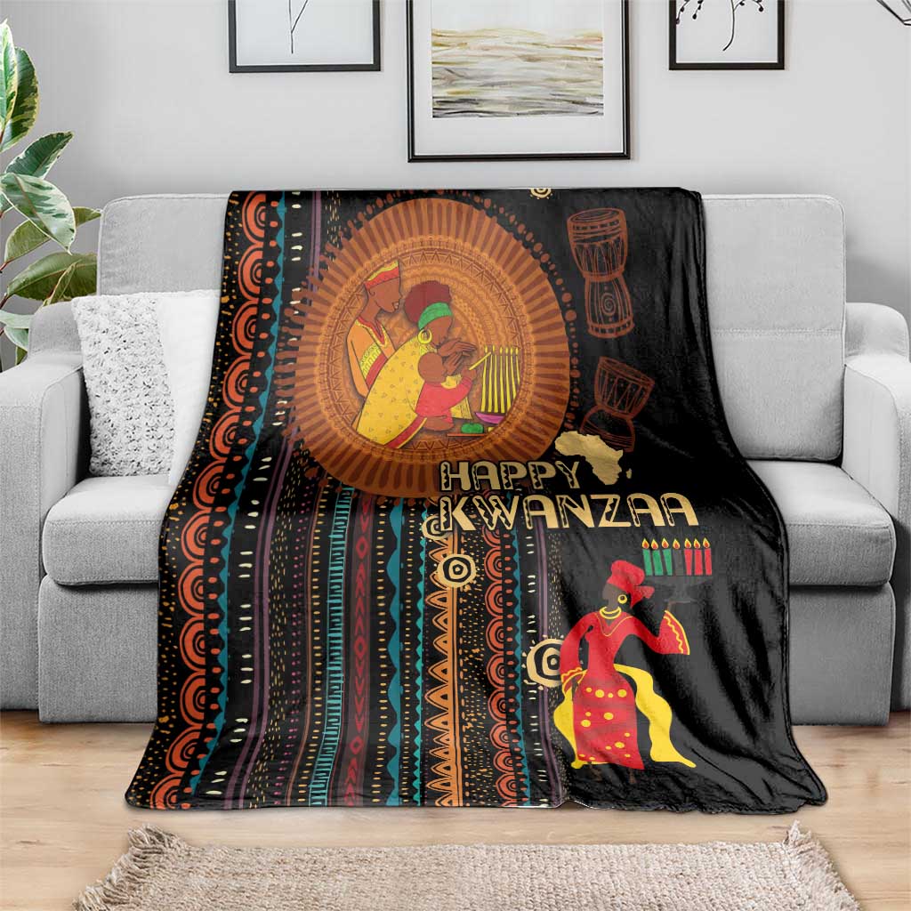 Black Kwanzaa blanket with colorful circular artwork, “Happy Kwanzaa” text, and dancer