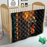Black quilt with African tribal pattern and Happy Kwanzaa text, crib blanket