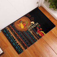 Black rubber doormat with Happy Kwanzaa center figure and colorful tribal stripes