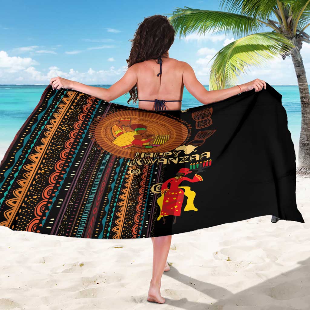 Black African tribal pattern sarong worn like a skirt with “Happy Kwanzaa” graphic