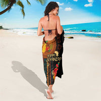 Black African tribal pattern sarong with “Happy Kwanzaa” text and colorful figures