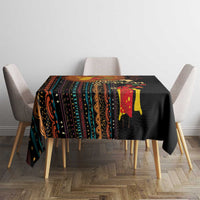 Black tribal-pattern tablecloth with colorful geometric stripes