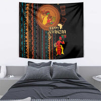 Black African tribal tapestry above bed with 'Happy Kwanzaa' and candleholder figure
