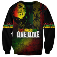 Unisex black sweatshirt with reggae portrait and “ONE LOVE” front text; patterned sleeves