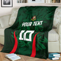 Green cricket blanket with red curved stripes, crest, 'YOUR TEXT' and number 10