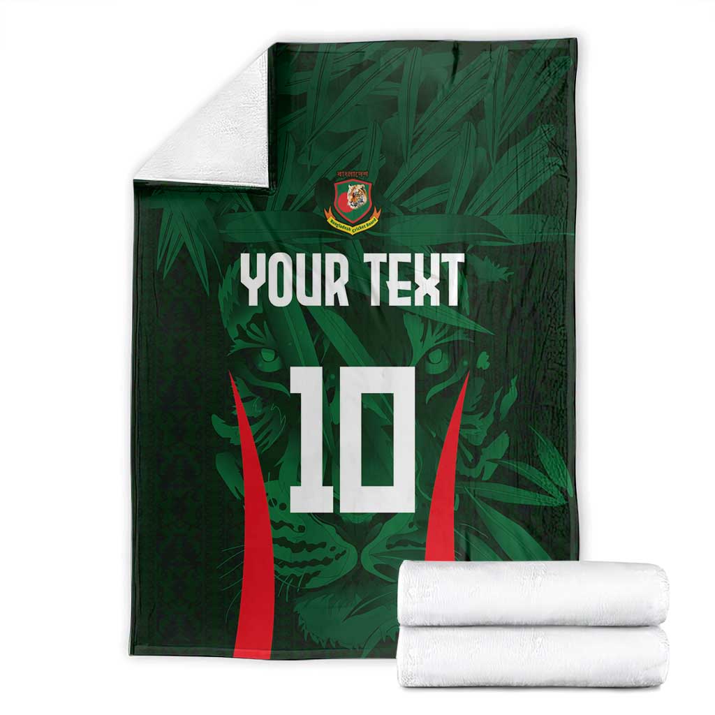 Green cricket blanket with crest, 'YOUR TEXT' and number 10; folded with white rolled towels