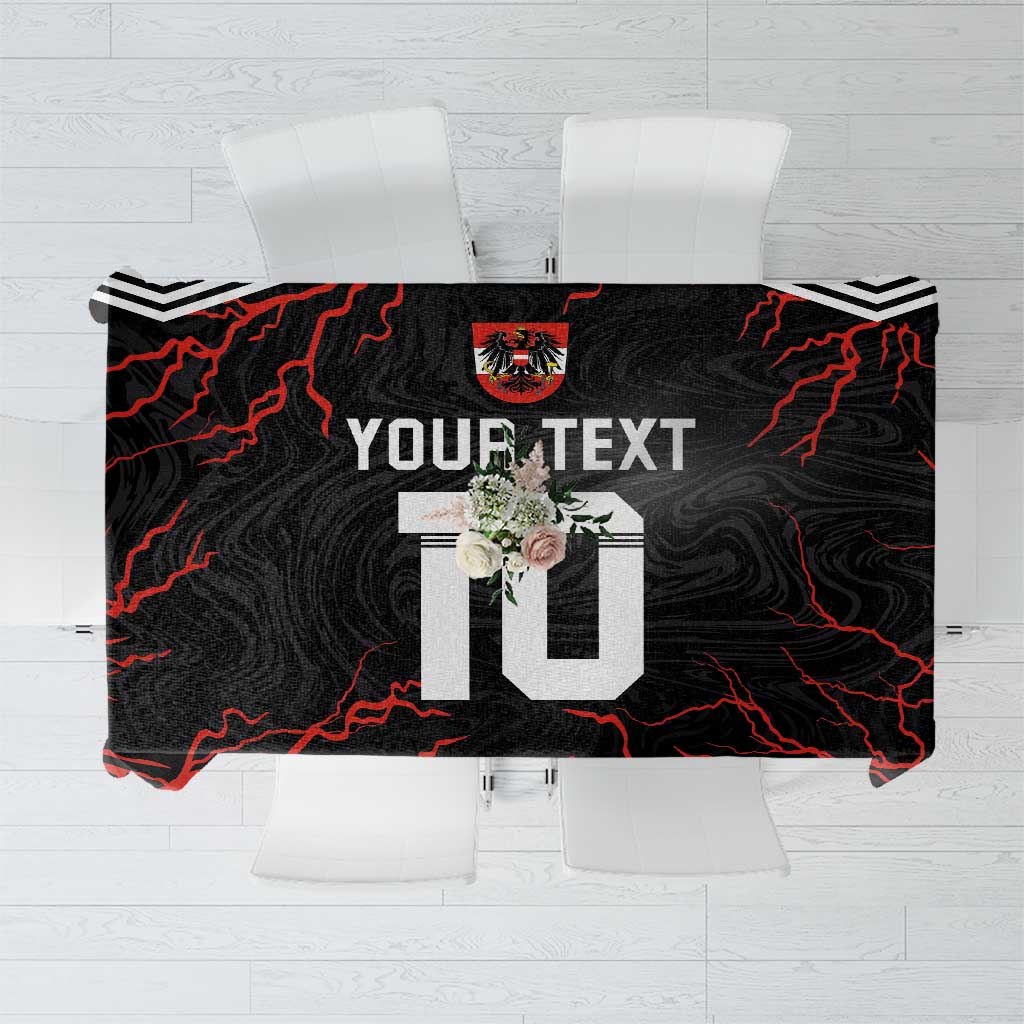 Black personalized tablecloth with red lightning lines and large '10' and crest