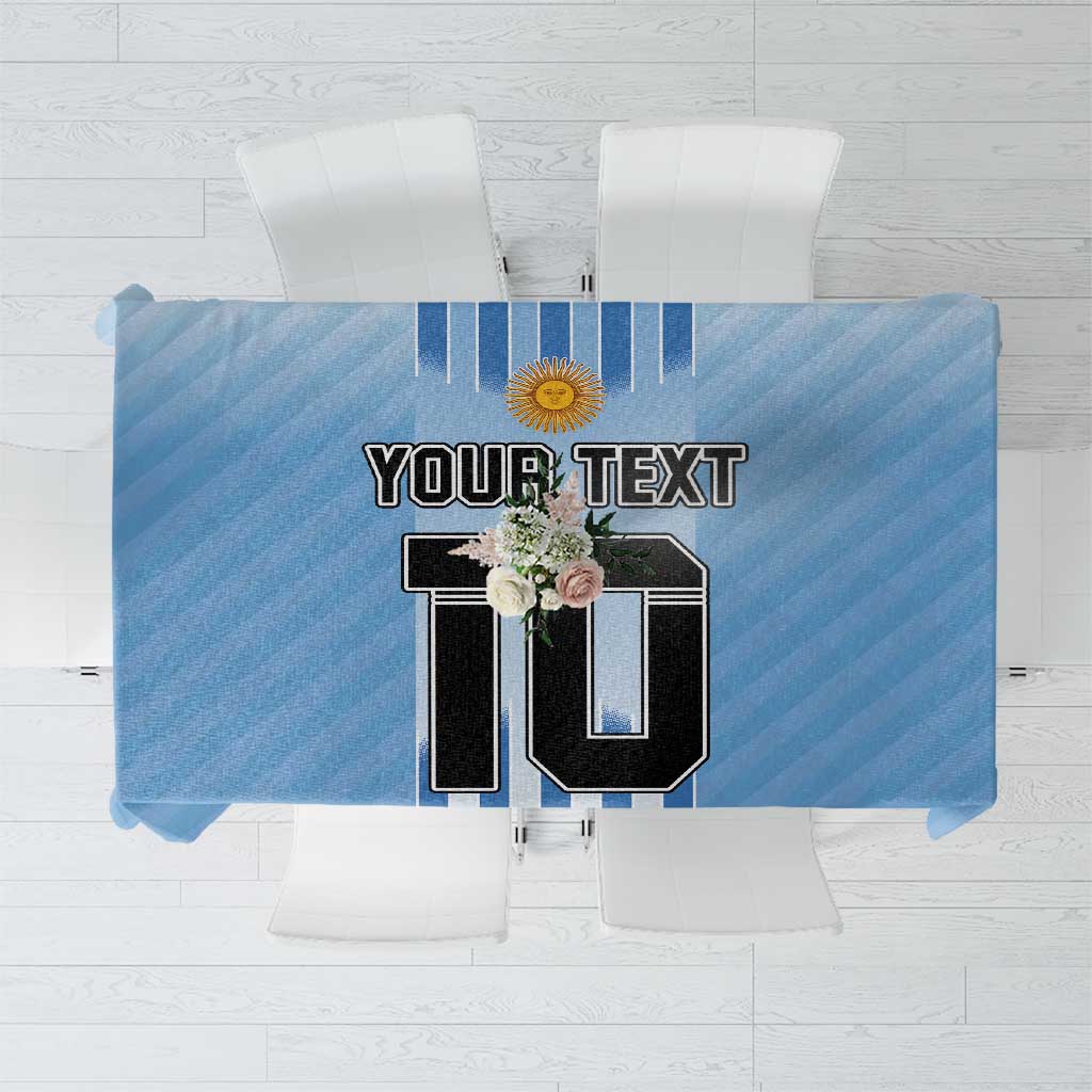Blue soccer-themed tablecloth with vertical stripes and trophy-style emblem center print