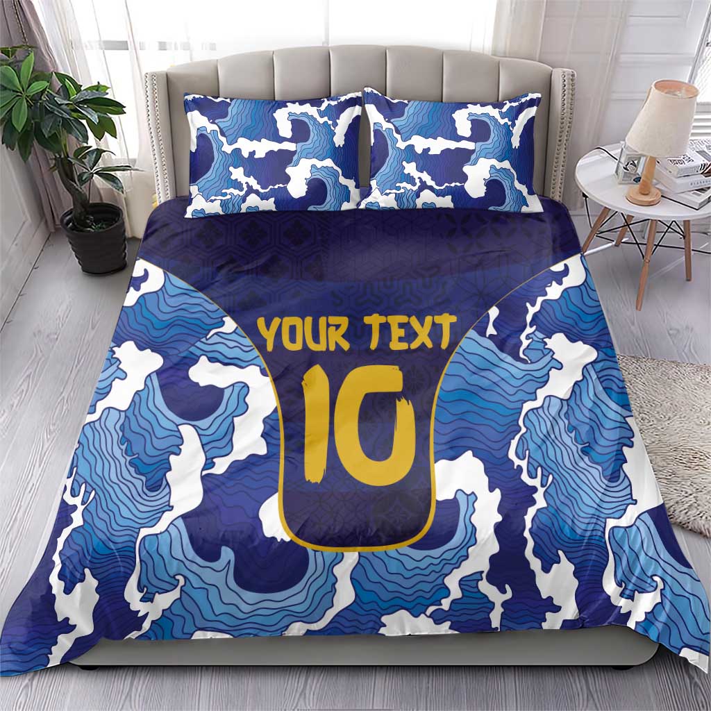 Blue bedding set with wave pattern, yellow 'YOUR TEXT' center design, and two pillows