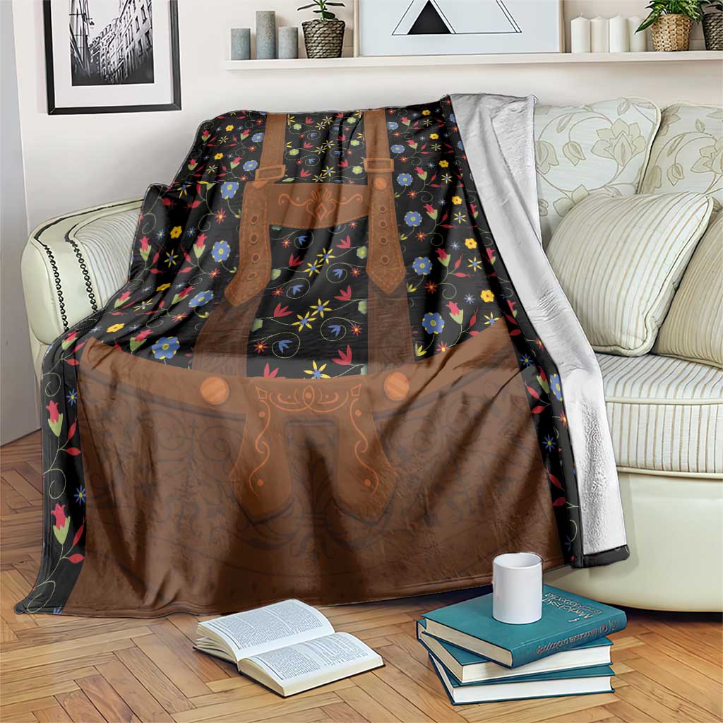 Black folk floral blanket with brown lederhosen-style apron and colorful flower print