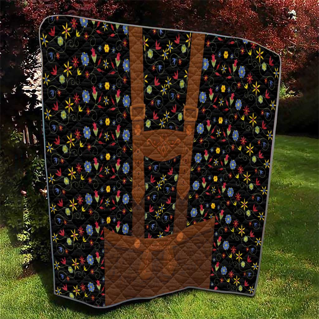 Brown patchwork quilt section on black background with multicolor floral patterns