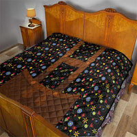 Black quilt bedspread with brown diamond quilting and multicolor floral motifs