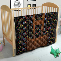 Black quilted baby bedding cover with brown center panel and colorful floral print